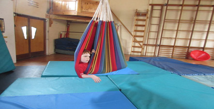 About Sensory-People.com - Photo of a child in a hammock